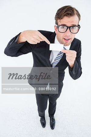 Geeky hipster businessman holding card on white background