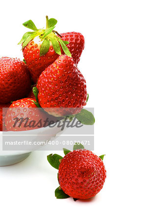 Arrangement of Perfect Ripe Strawberries on Edge of Bowl isolated on white background