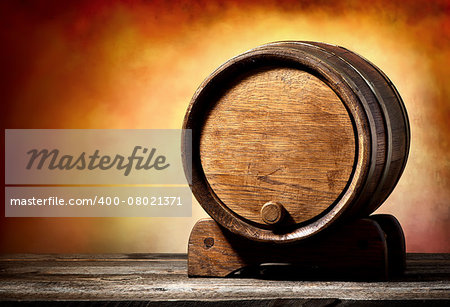 Wooden cask on a stand on a colored background