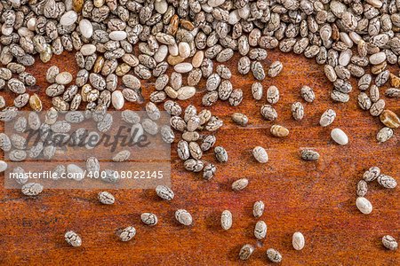 chia seeds on a rustic wood - close up background