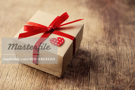 Gift, little box of kraft paper with a red ribbon