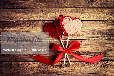 Two heart-shaped candy on a wooden surface, Valentines Day background, wedding day