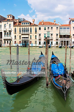 Two gondolas on the Grand Canal in Venice with old beautiful buildings in the background