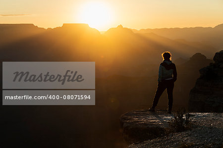 View of a girl watching sunset at Grand Canyon of Colorado