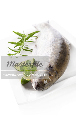 Delicious trout with herbs prepared for cooking. Culinary seafood cooking.