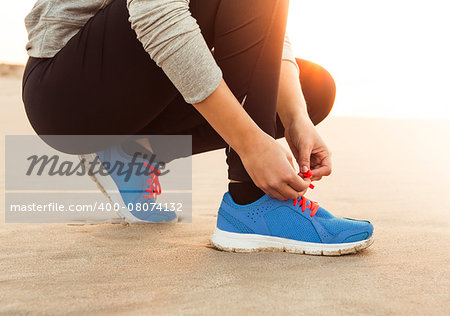 Runner woman tying the shoelaces