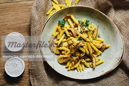 pasta penne with mushrooms grilled in sour cream sauce