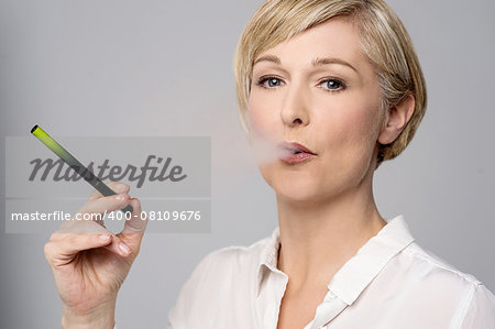 Woman smoking modern e-cigarette