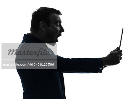 one  business man holding digital tablet surisped shocked in silhouette on white background