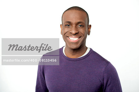 Smiling middle aged african man looking at camera