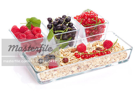 Healthy breakfast with muesli and berries. Isolated on white background