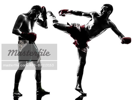 two  men exercising thai boxing in silhouette studio on white background