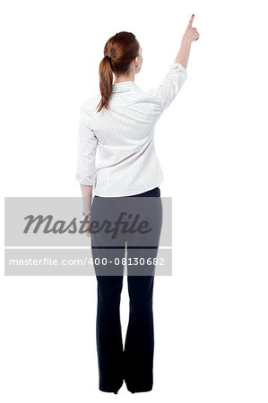 Rear view of woman pointing empty space