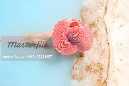 woman in a red hat takes a relax bath