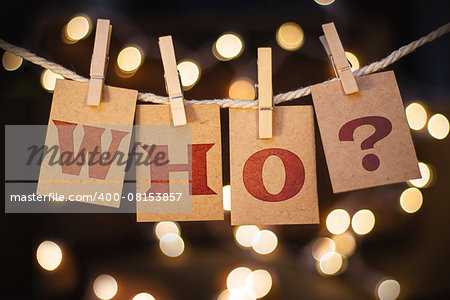 The word WHO? printed on clothespin clipped cards in front of defocused glowing lights.
