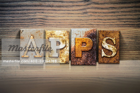 The word "APPS" written in rusty metal letterpress type sitting on a wooden ledge background.