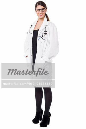 Full length portrait of young female physician over white