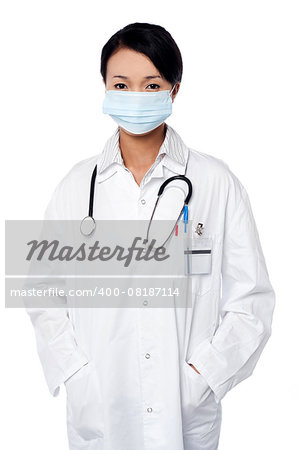 Young female surgeon wearing a face mask