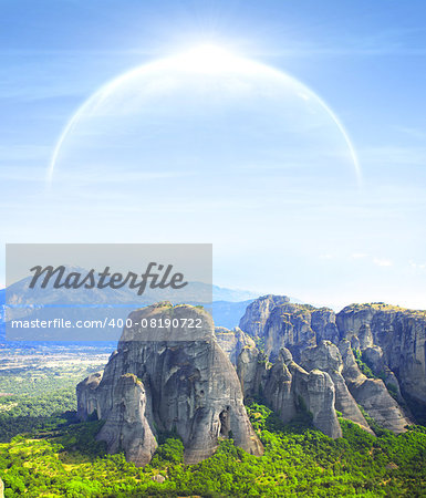 Fantastic landscape with planet, mountains and jingle