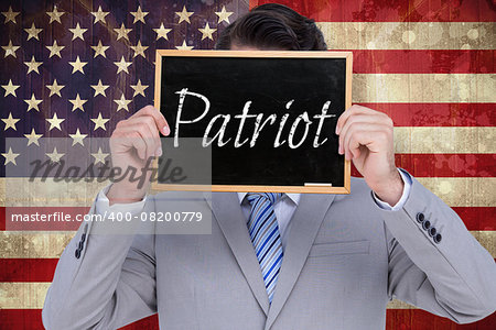 Businessman showing board against usa flag in grunge effect