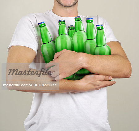 Consumer with a lot of bottles of beer in their hands