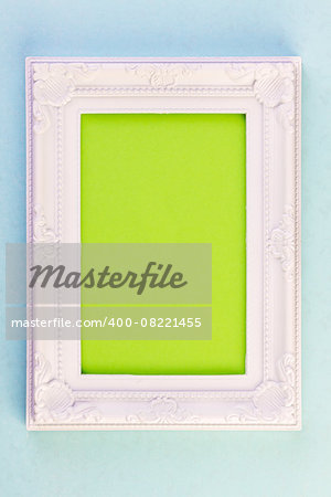 White Frame on blue background with green for your copy
