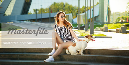 Hipster Fashion Woman with her Dog in the City. Modern Youth Lifestyle Concept.