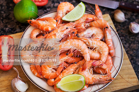 Fresh delicious prawns with lime on the plate