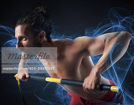 Muscular man training with a weight bar