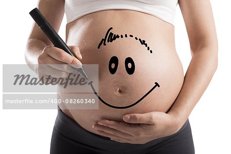 Smiley drawn on a pregnant woman stomach