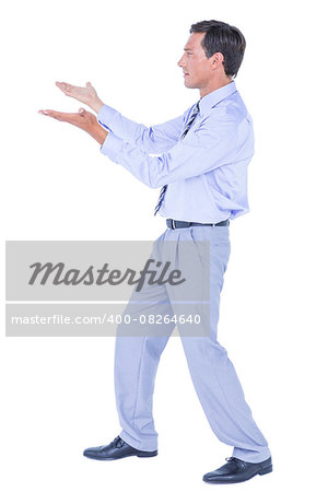 Businessman walking while gesturing with hands on a white background