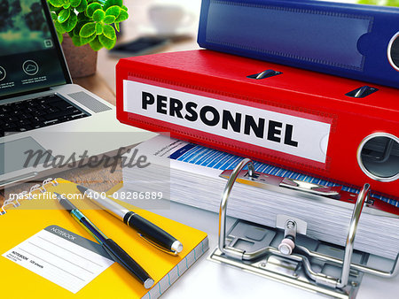 Personnel - Red Ring Binder on Office Desktop with Office Supplies and Modern Laptop. Business Concept on Blurred Background. Toned Illustration.