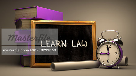 Learn Law - Chalkboard with Hand Drawn Inspirational Text, Stack of Books, Alarm Clock and Rolls of Paper on Blurred Background. Toned Image.