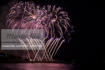 Fireworks over sea and Reflecting in Water