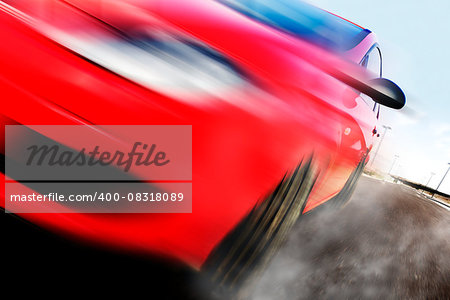 Red car and speed.Motion blur and road