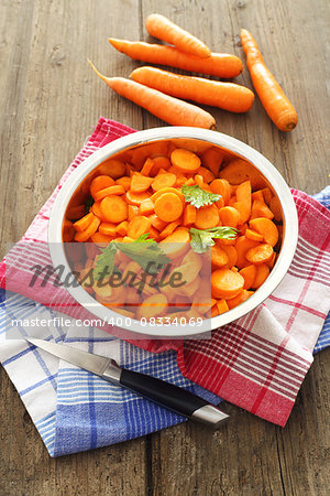 chopped carrots in bowl of steel , shallow dof