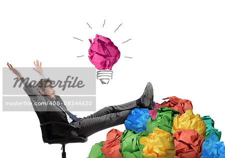 Businessman sitting with pile of tangle paper