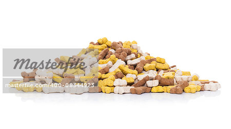 big mound of pet or dog bone cookies as food treats, isolated on white background