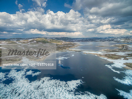 Aerial scenic view of icy lake in Norway, Hardangervidda