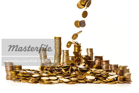 coins falling into a pile isolated on white