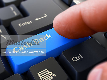 Computer User Presses Blue Button Cash Back on Black Keyboard. Closeup View. Blurred Background.