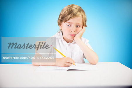 Cute pupil thinking against blue background with vignette