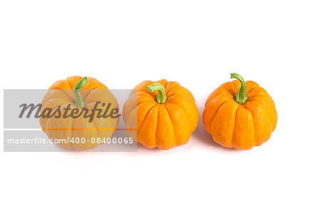 Small orange pumpkins, top view, isolated on white background