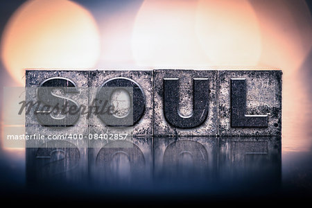 The word "SOUL" written in vintage ink stained letterpress type.