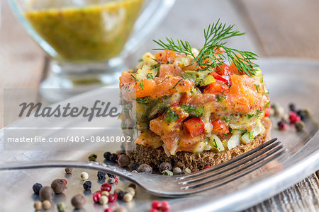 Tartare with salmon on a slice of .