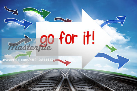 The word go for it! and arrow against railway leading to blue sky