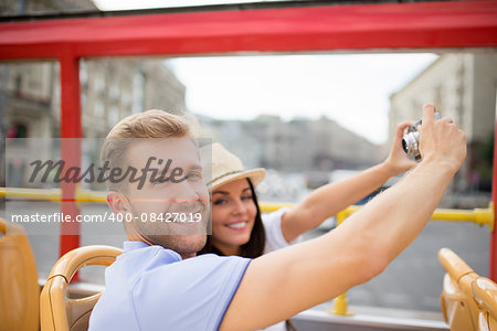 Smiling couple at the tour bus