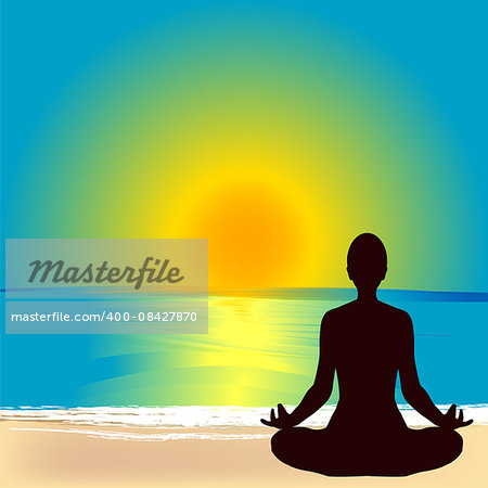 Silhouette of  young woman practicing yoga on the beach at sunrise