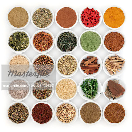 Superfood and herb selection for men in porcelain bowls over white background.