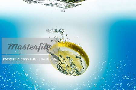Image of a lemon slice falling in water